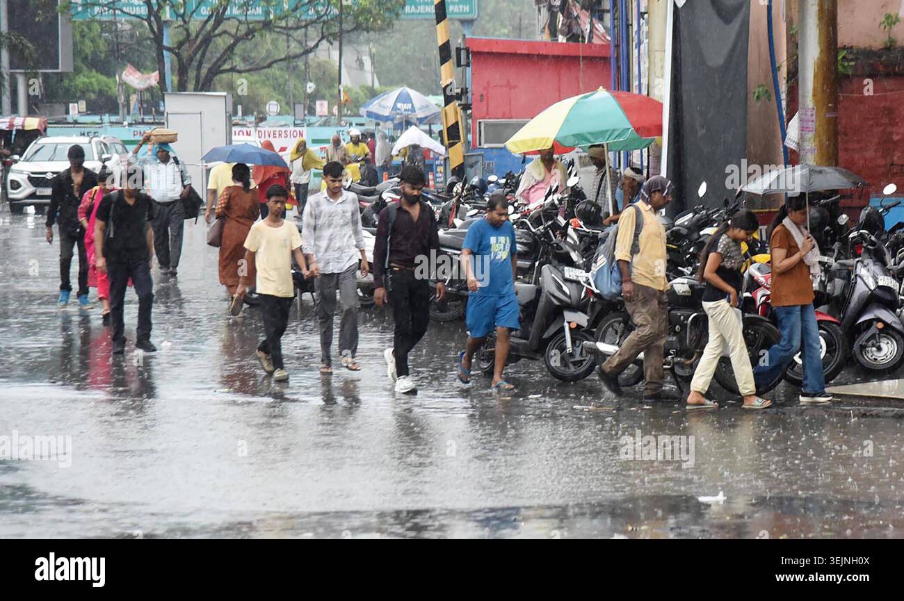 PATNA, INDIA - MAY 29: People crossing during rain falling at Station ...