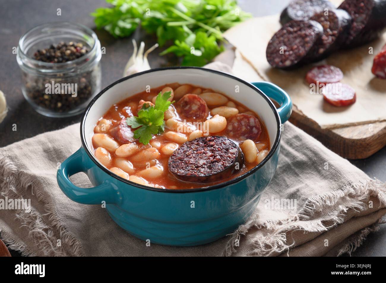 Spanish fabada on brown table. Copy space Stock Photo
