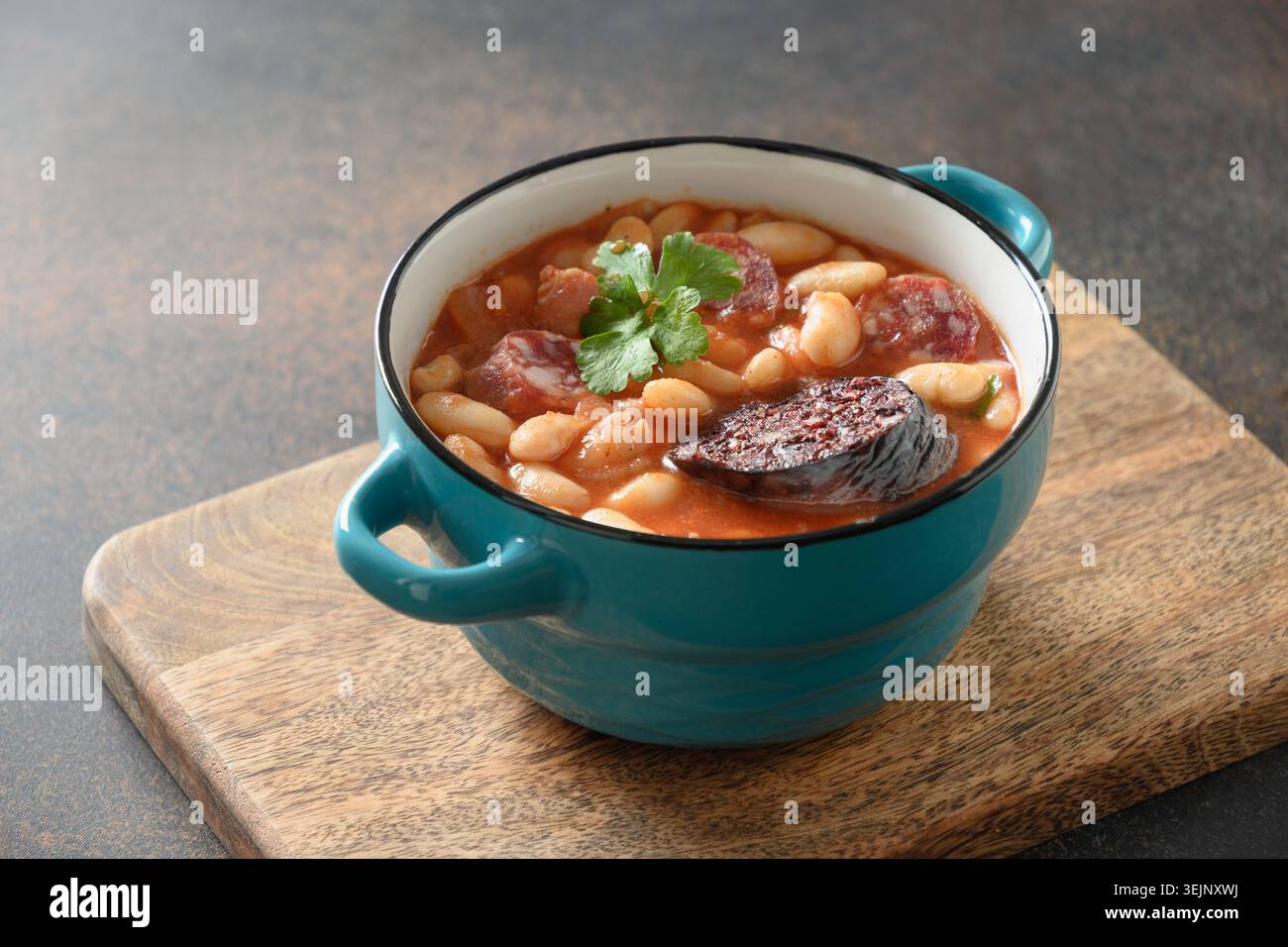 Spanish fabada on brown table. Copy space Stock Photo
