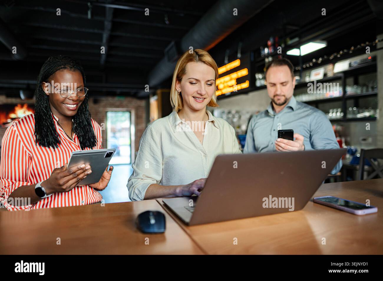 Diverse business professionals collaborating remotely using technology Stock Photo