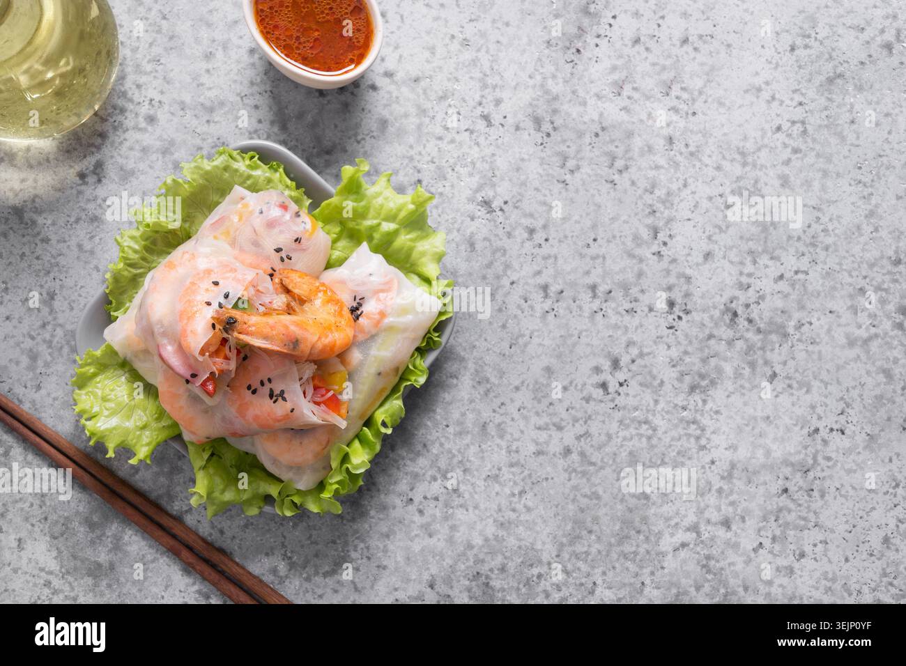 Spring rolls with prawn, noodles and vegetables in rice paper. Asian cuisine. Stock Photo