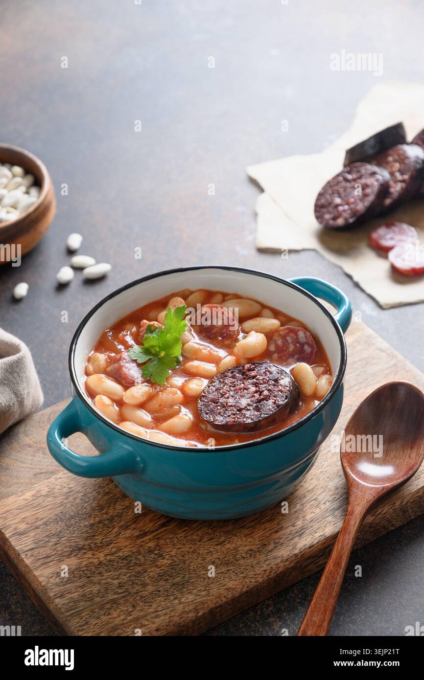 Spanish fabada on brown table. Copy space Stock Photo