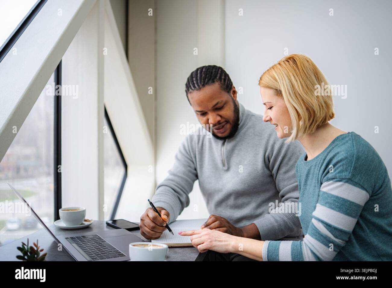 Business people collaborating on project in modern office Stock Photo