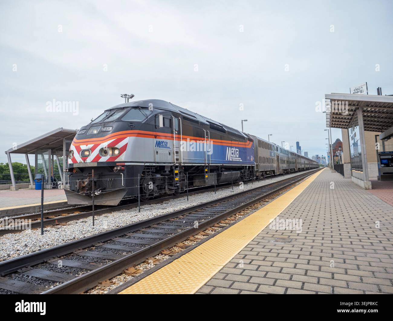 CHICAGO, IL - MAY 26: A Metra passenger train approaches a station ...