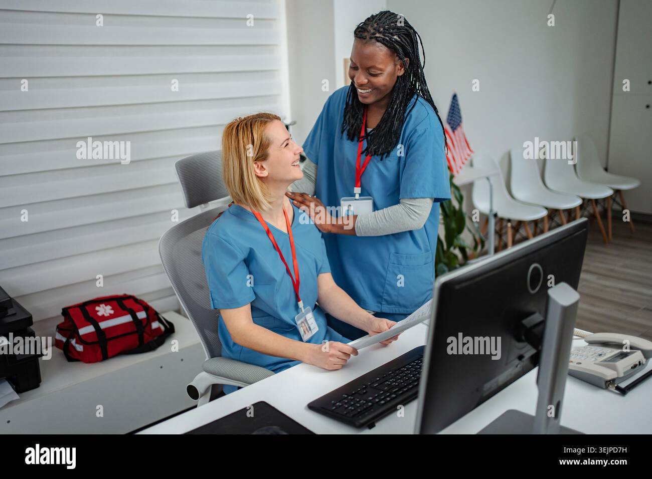 Nurses collaborating in modern hospital office Stock Photo