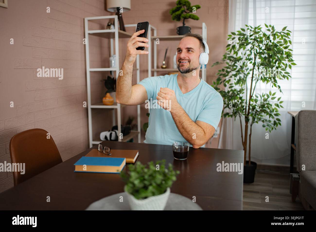 Man learning sign language during video call communication Stock Photo