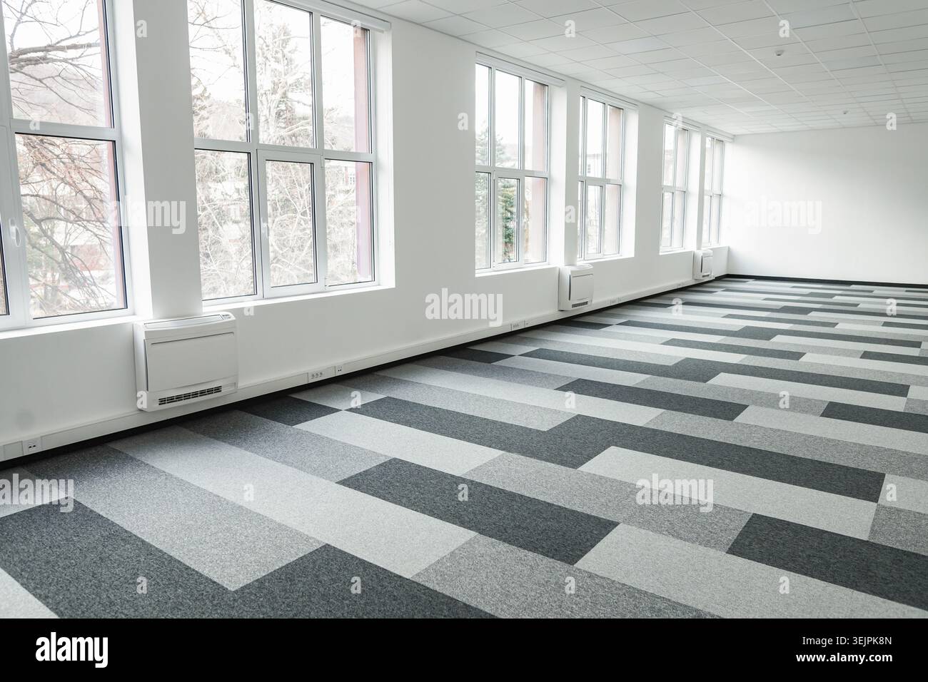 Empty office space With Checkered Floor and Windows Stock Photo