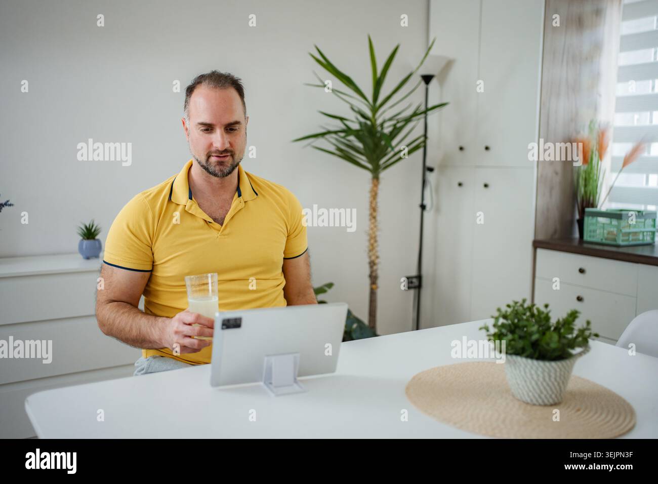 Man learning working from home using digital tablet Stock Photo