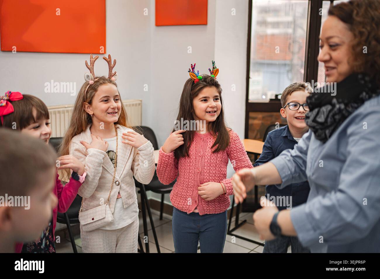 Teacher and elementary students at language school class Stock Photo