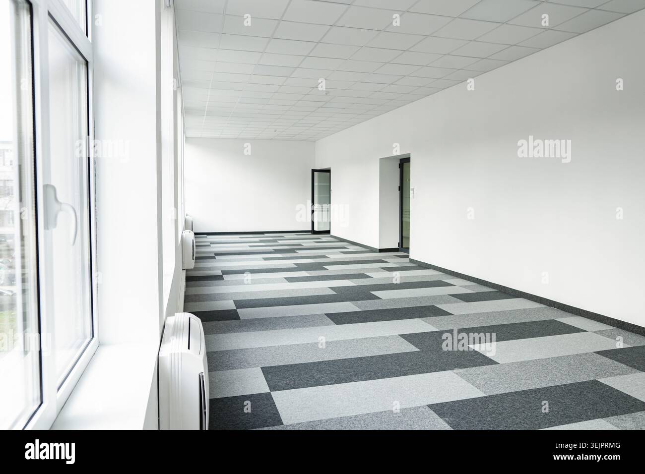 Empty office space With Checkered Floor and Windows Stock Photo