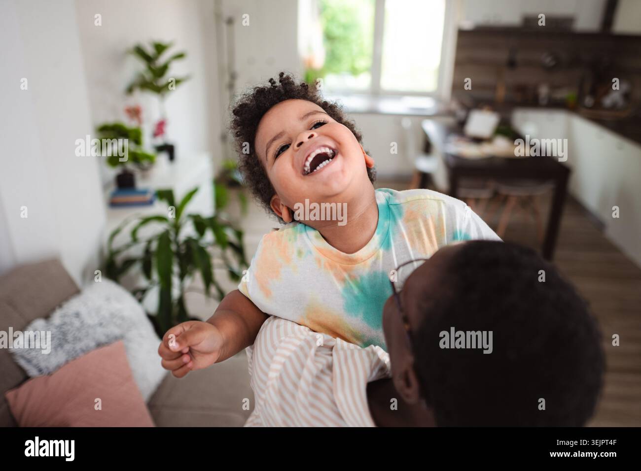 Black father and son laughing having fun at home Stock Photo