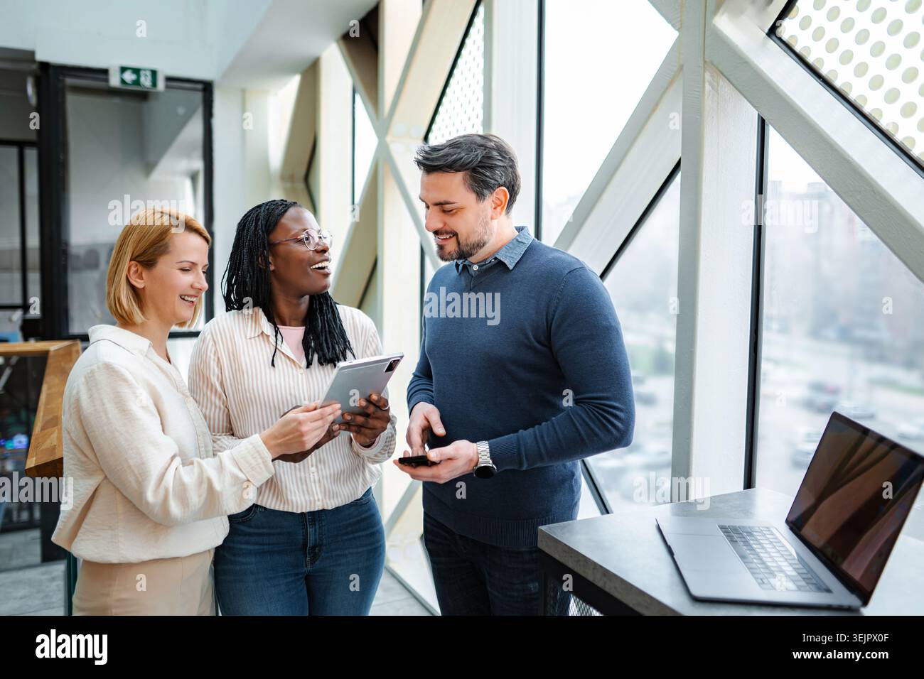 Diverse startup team collaborating using digital tablet and technology Stock Photo
