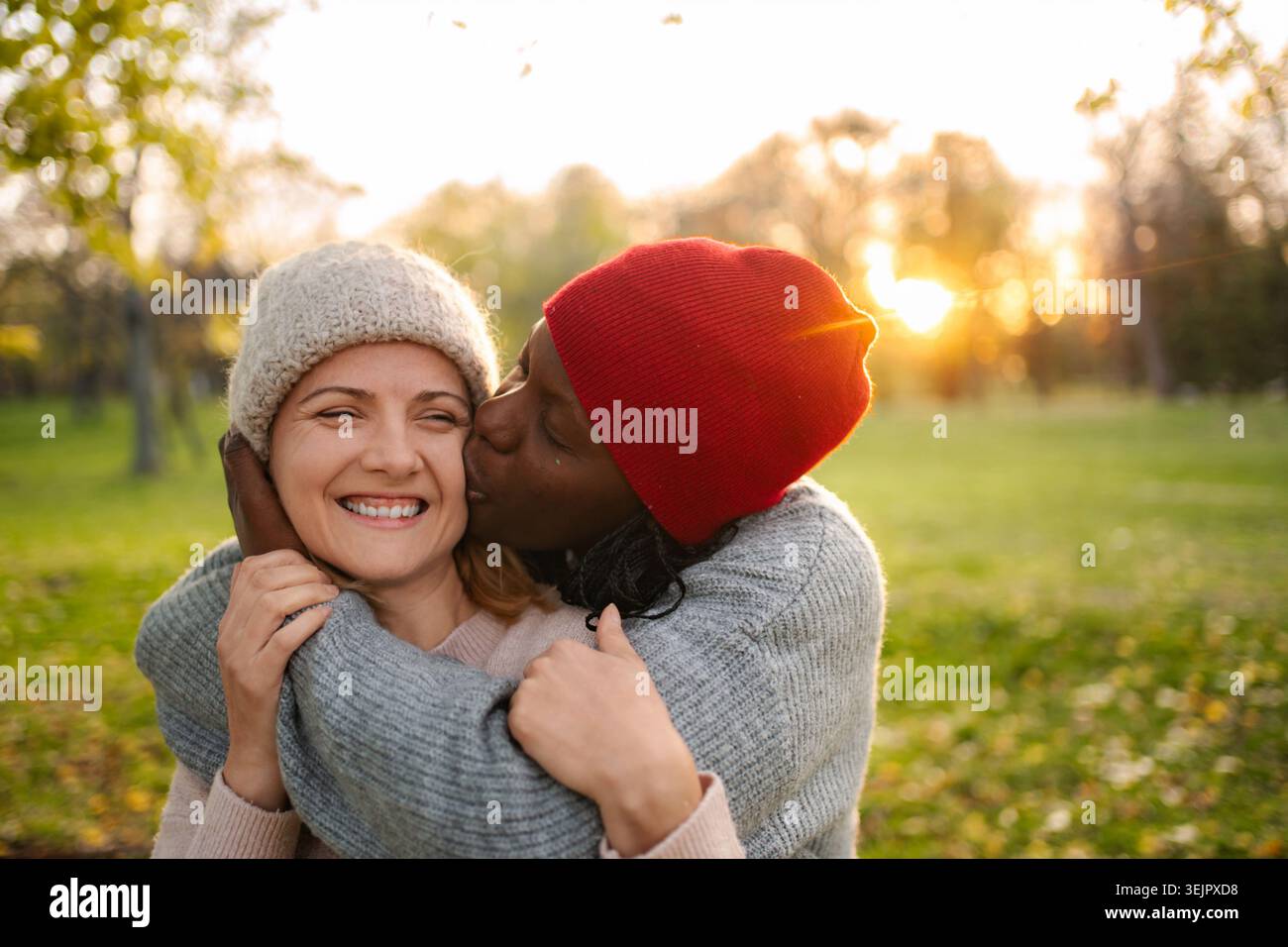 Diverse women showing affection from different generations Stock Photo