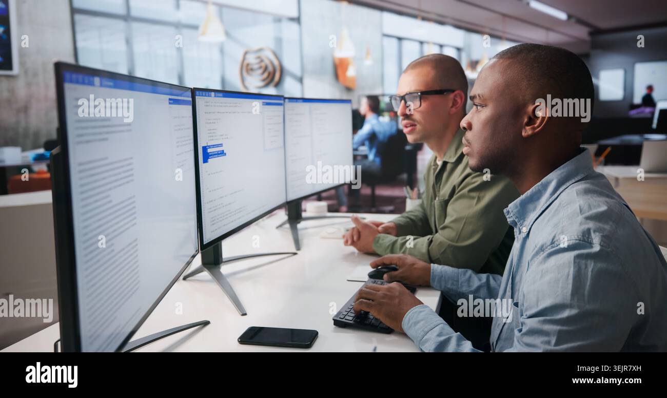 Two Software Engineers Work Together On Secure Web Application Coding. Stock Photo