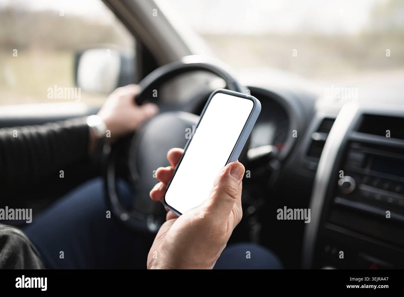 Driver Using Smartphone With Blank Screen Inside Car Stock Photo