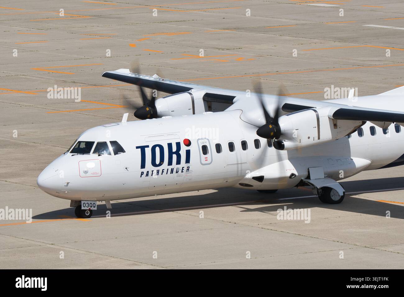Toki Air ATR 42-600 (JA03QQ) with airline branding visible on the fuselage while propellers rotate Stock Photo