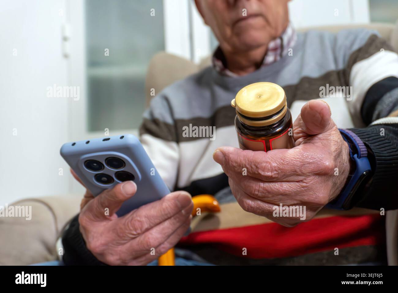 Senior man using smartphone for medication management Stock Photo