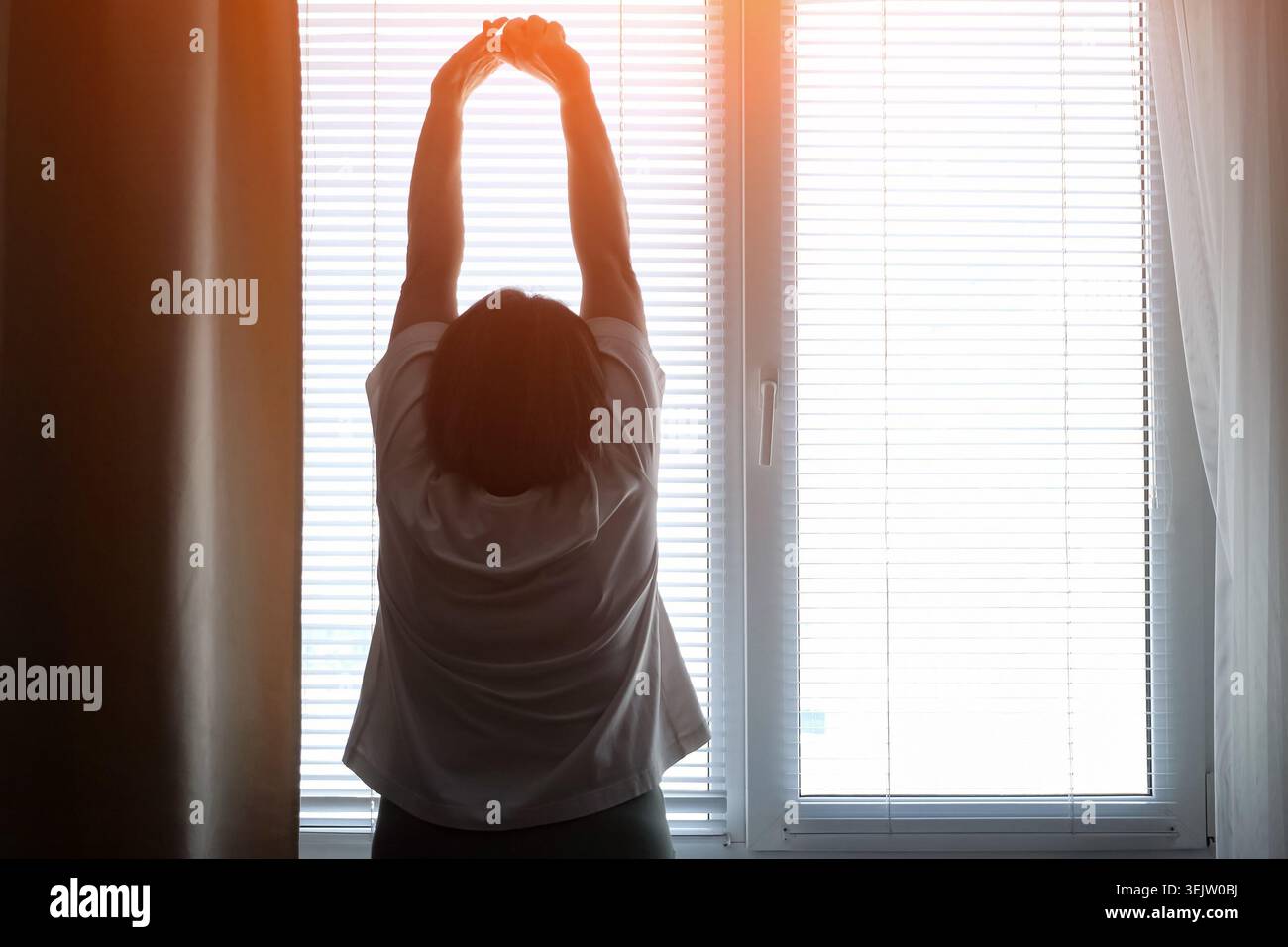 Woman silhouette arms up hi-res stock photography and images - Alamy