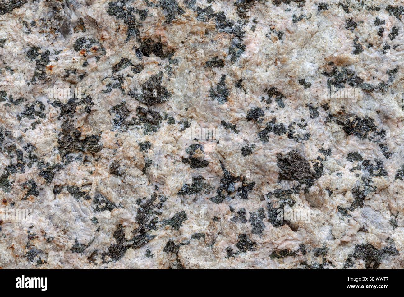 Roughly cut granite stone macro background texture material Stock Photo