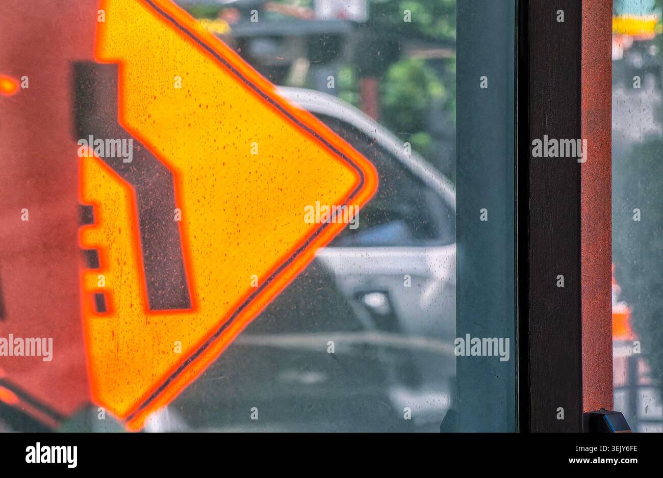 A parked car reflected in an office building window Stock Photo