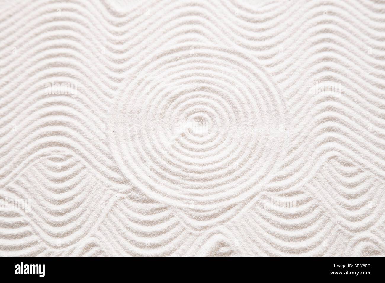 Circle pattern in white sand Stock Photo