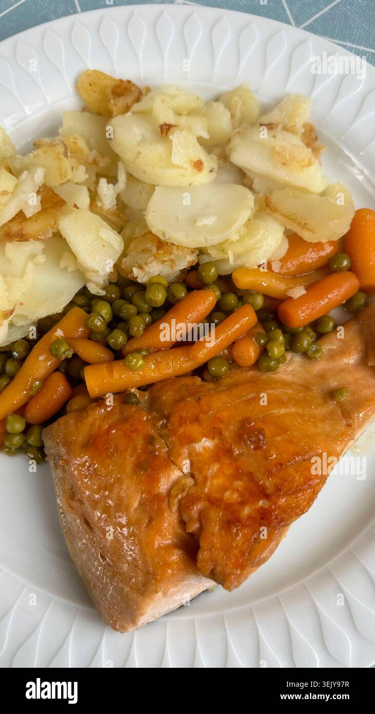 Salmon with vegetables and potatoes Stock Photo