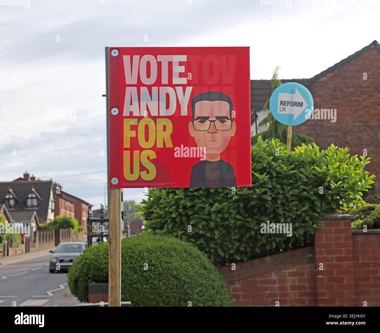 Who is in front? Labour Vote Andy For Us and Reform UK garden signs in Ashton-in-Makerfield during the 2026 Makerfield by-election campaign. Stock Photo