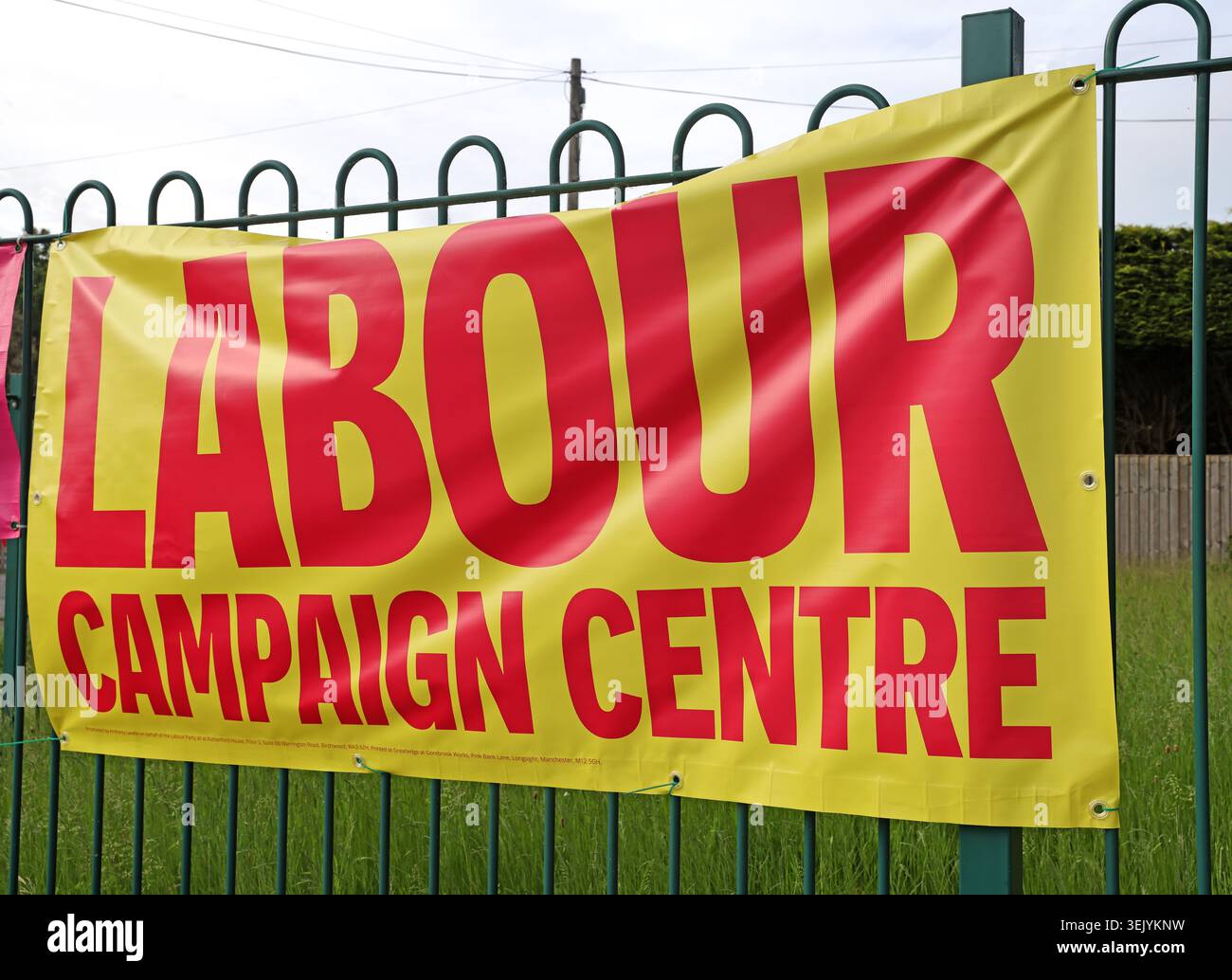Yellow Labour campaign centre banner outside 2 Walter Street, Ashton-in-Makerfield, during Andy Burnham’s Makerfield by-election campaign. Stock Photo