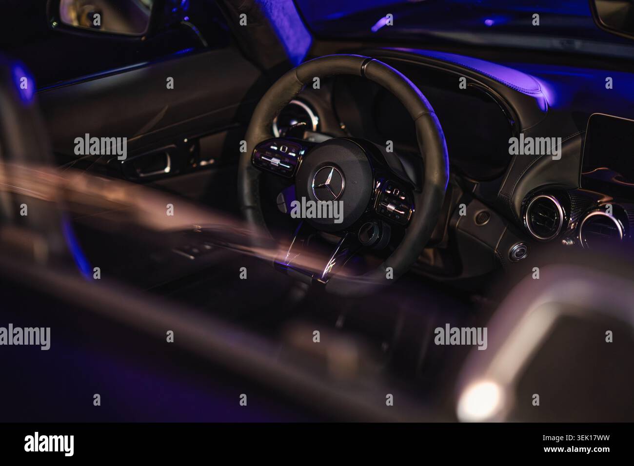 Rome, italy 29 may 2026: mercedes-benz luxury car interior with leather steering wheel, dashboard and ambient blue night lighting, modern high-end det Stock Photo