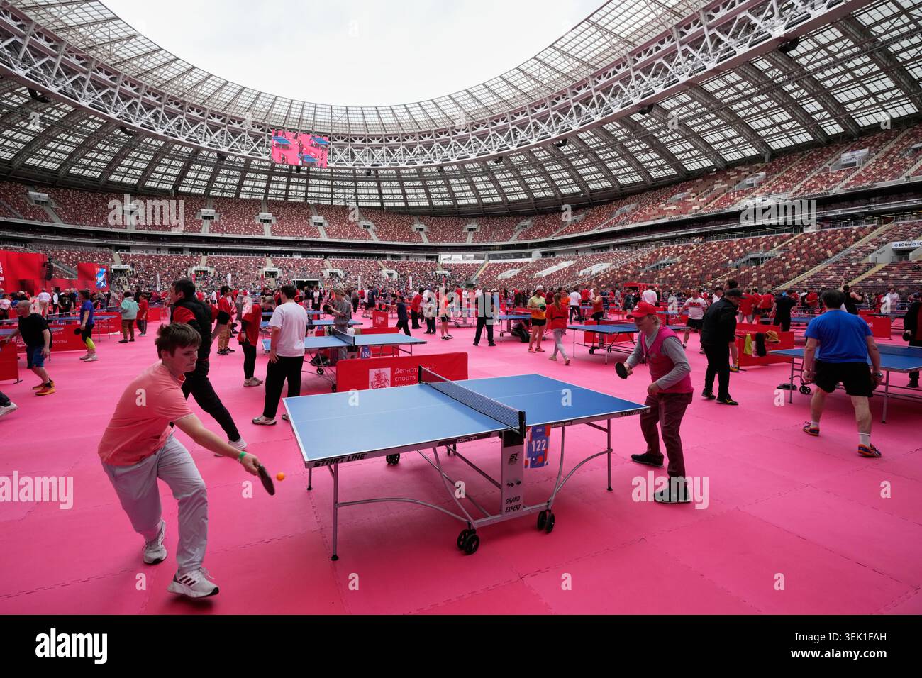People play table tennis on the pitch of the Luzhniki Stadium during ...