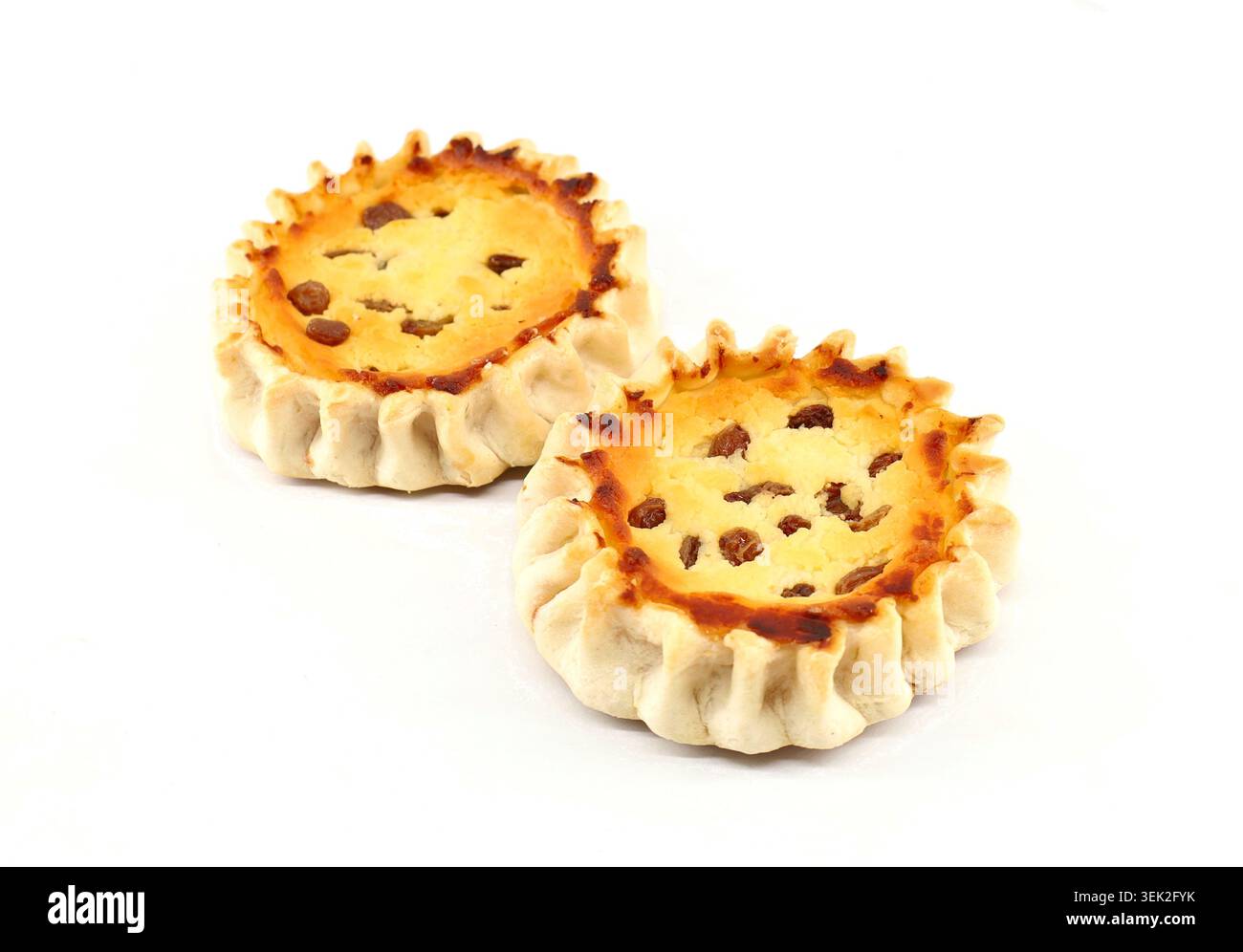 Pardulas or Formaggelle on white background. It is a typical Sardinian Easter cake made with ricotta or cheese. Stock Photo
