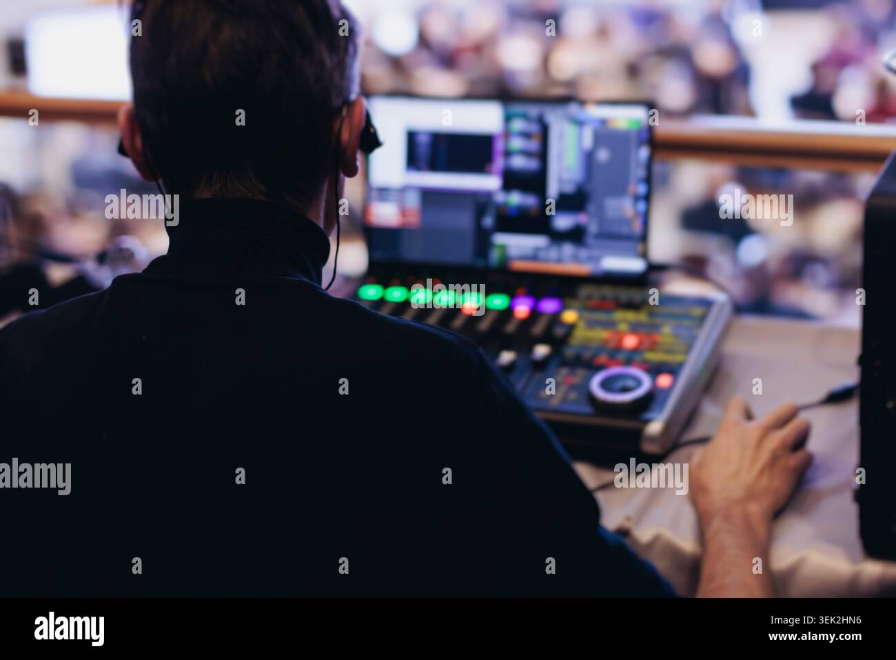 Lighting Design Operator Lighting technician operator working on mixing console, workplace ...