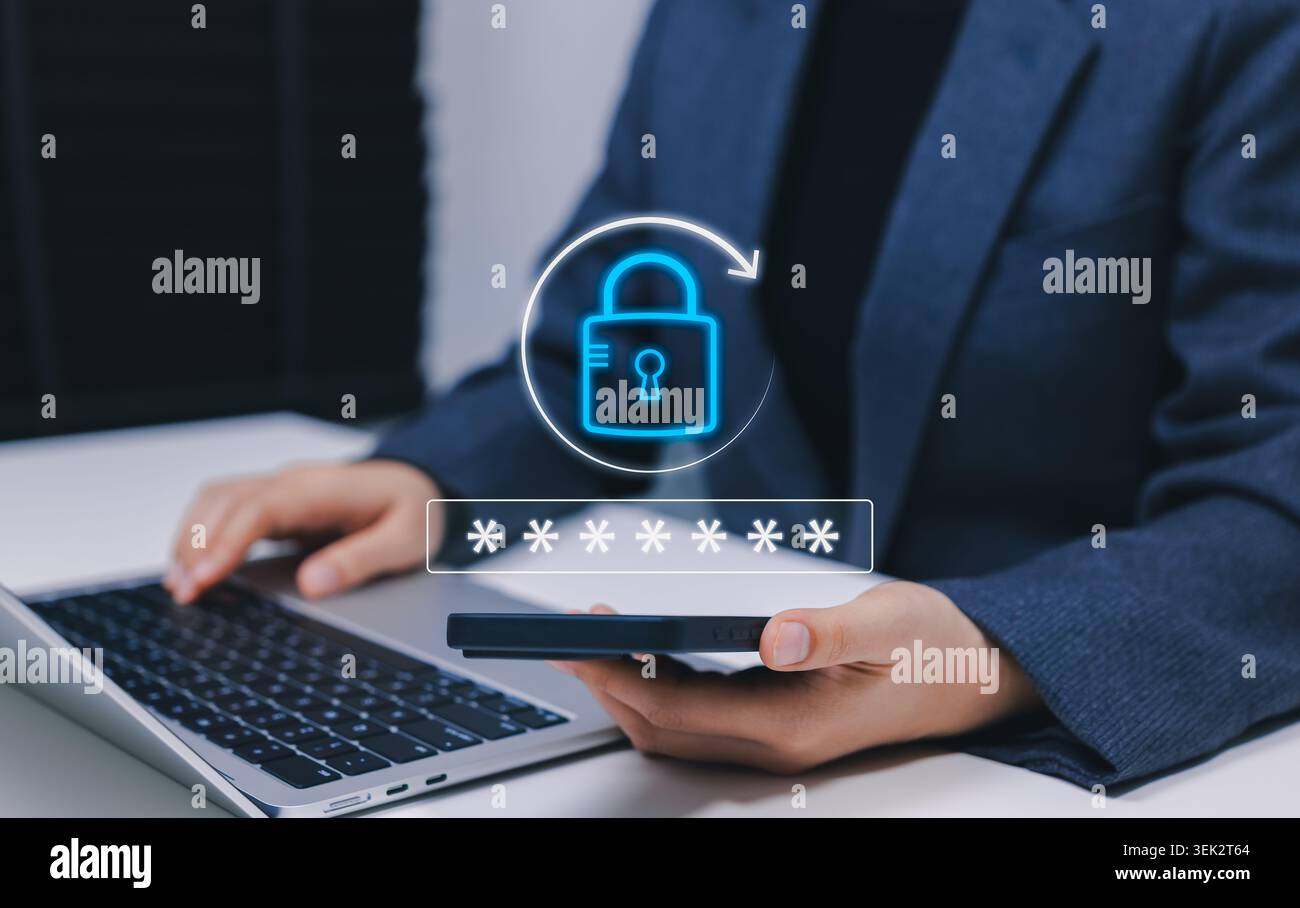 Password reset security and forgotten password recovery concept. Person using smartphone and laptop, showing digital lock, secure login, account Stock Photo