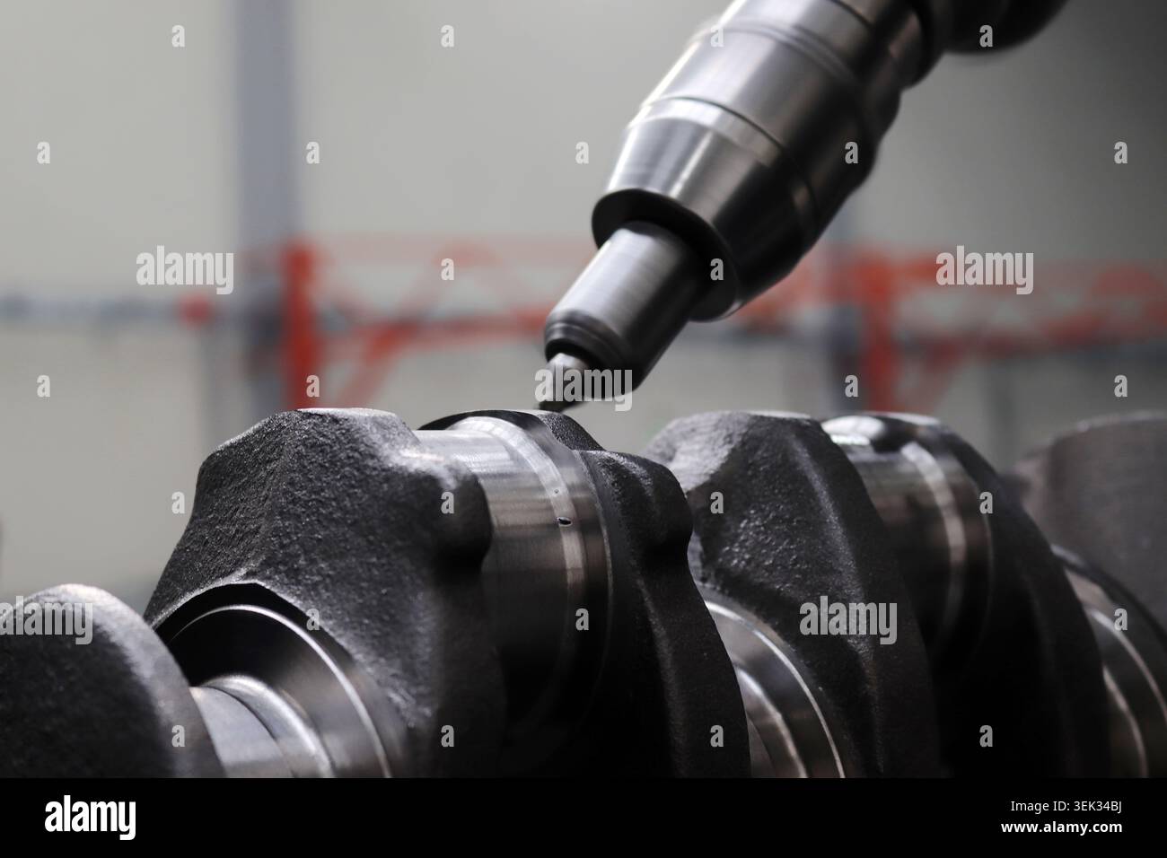 Engineers are working on the crankshaft. Stock Photo