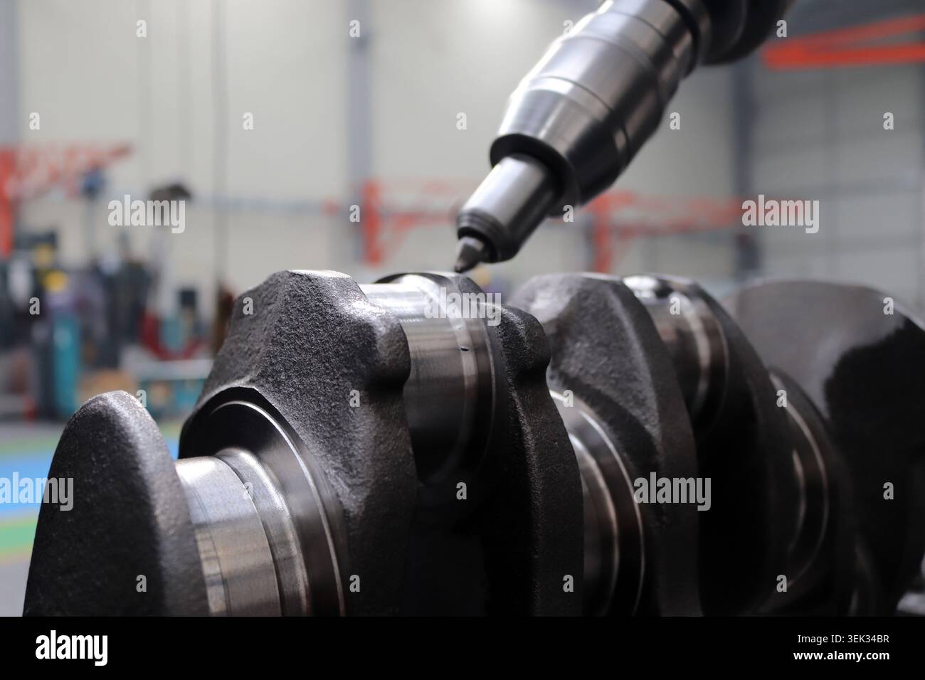 Engineers are working on the crankshaft. Stock Photo