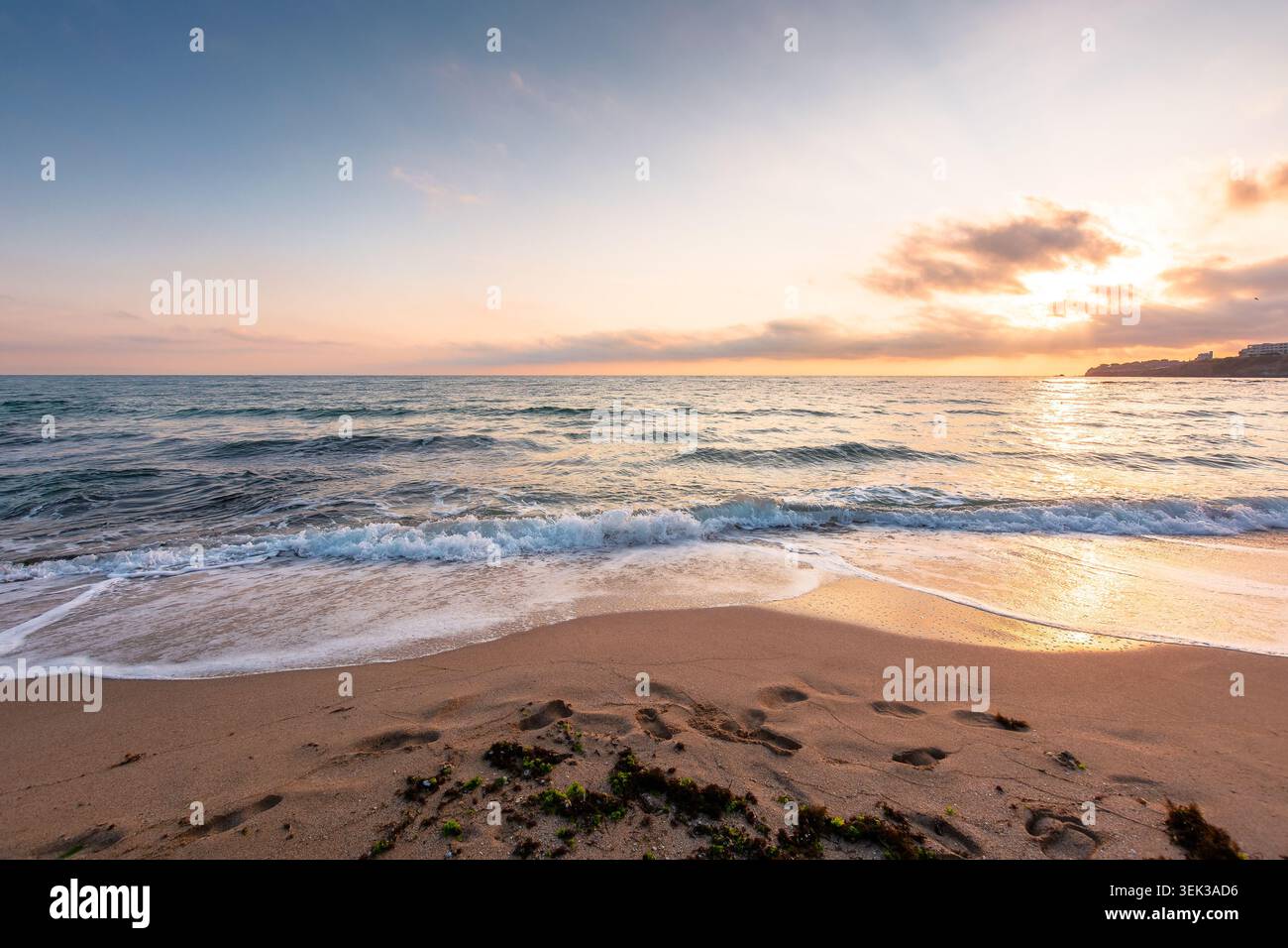 black sea landscape on a summer morning. bulgaria nature landscape with sandy beach. summer vacation at the sea shore concept. calm waves and empty be Stock Photo
