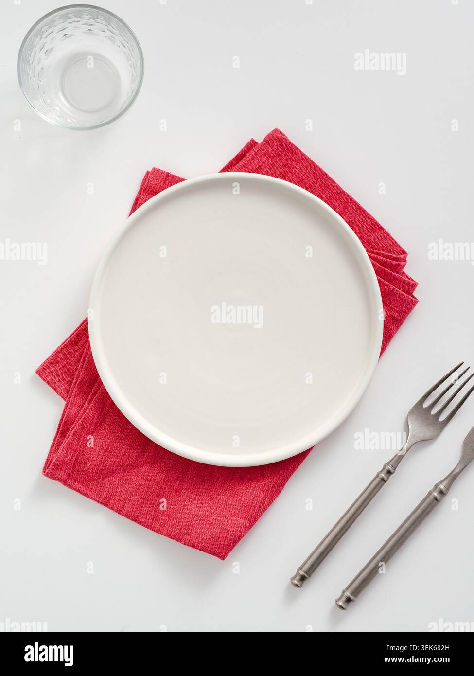 Elegant dinner place setting on white background Stock Photo