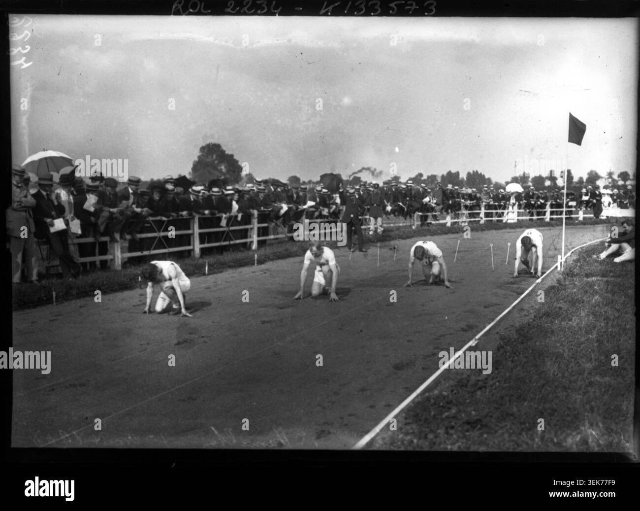 The runners line up at the start of the 200 metre scratch race during ...