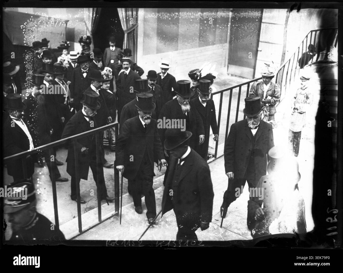 President Fallières arrives at the dog exhibition held in the Tuileries Garden in Paris in 1908, recorded in a press photograph by Agence Rol. The image documents the presidential visit to a canine exhibition attended by officials. Stock Photo