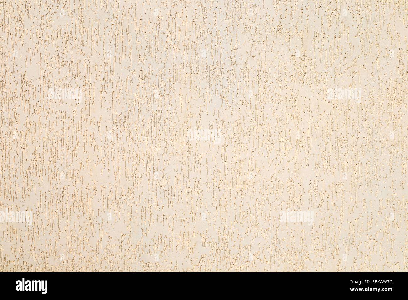 Beige textured plaster wall with vertical stucco pattern for background and interior design Stock Photo