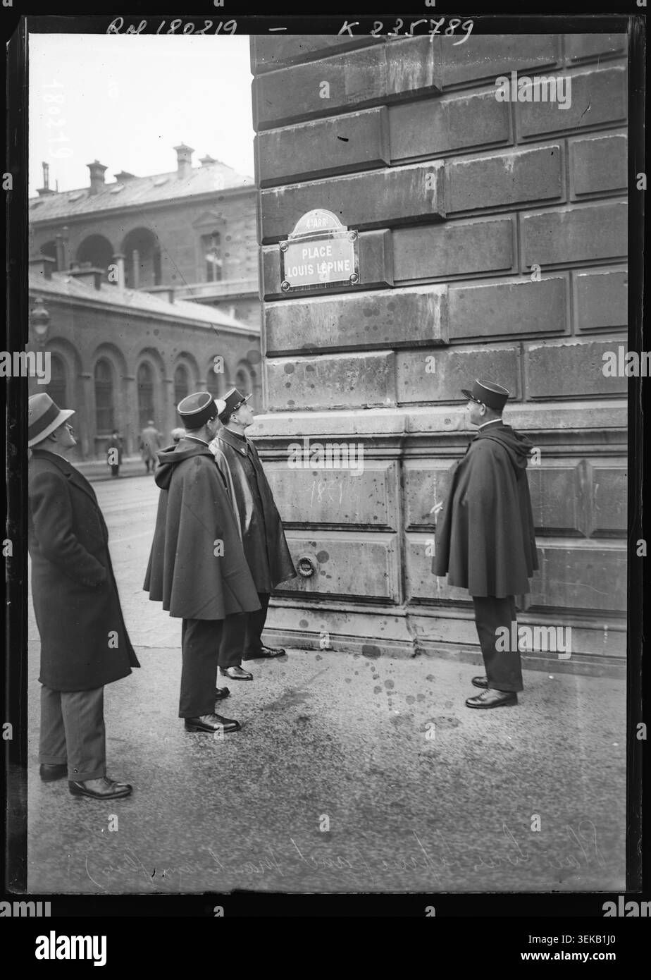 Agence Rol photographed the Place Louis Lépine area on Île de la Cité in Paris in 1934 during a municipal inauguration, recording police officers and street signage at the former flower market. Stock Photo
