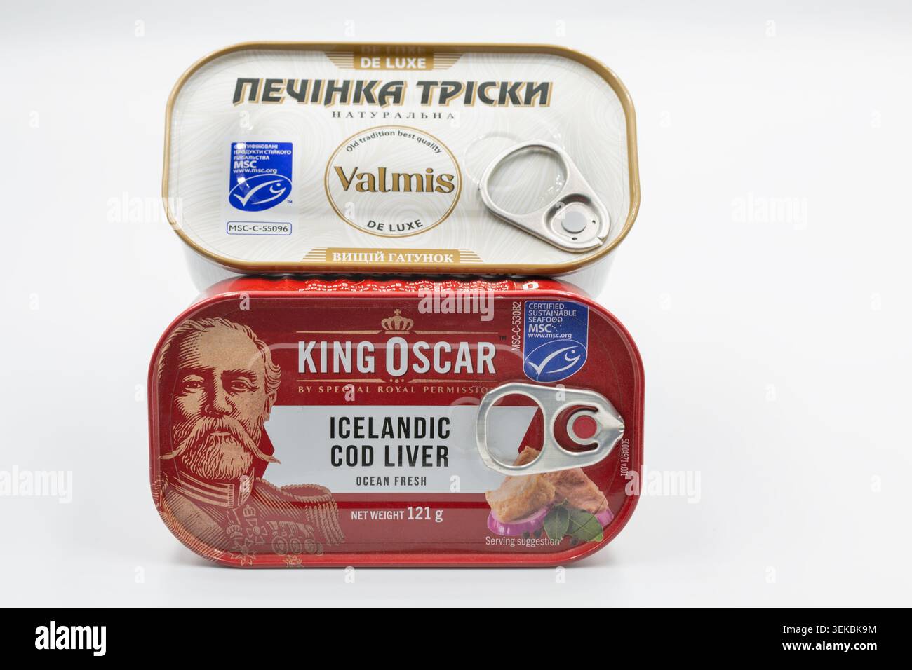 Kyiv, Ukraine - May 17, 2024: Two canned tins of cod liver, including King Oscar Icelandic Cod Liver and Valmis De Luxe natural cod liver, product sho Stock Photo