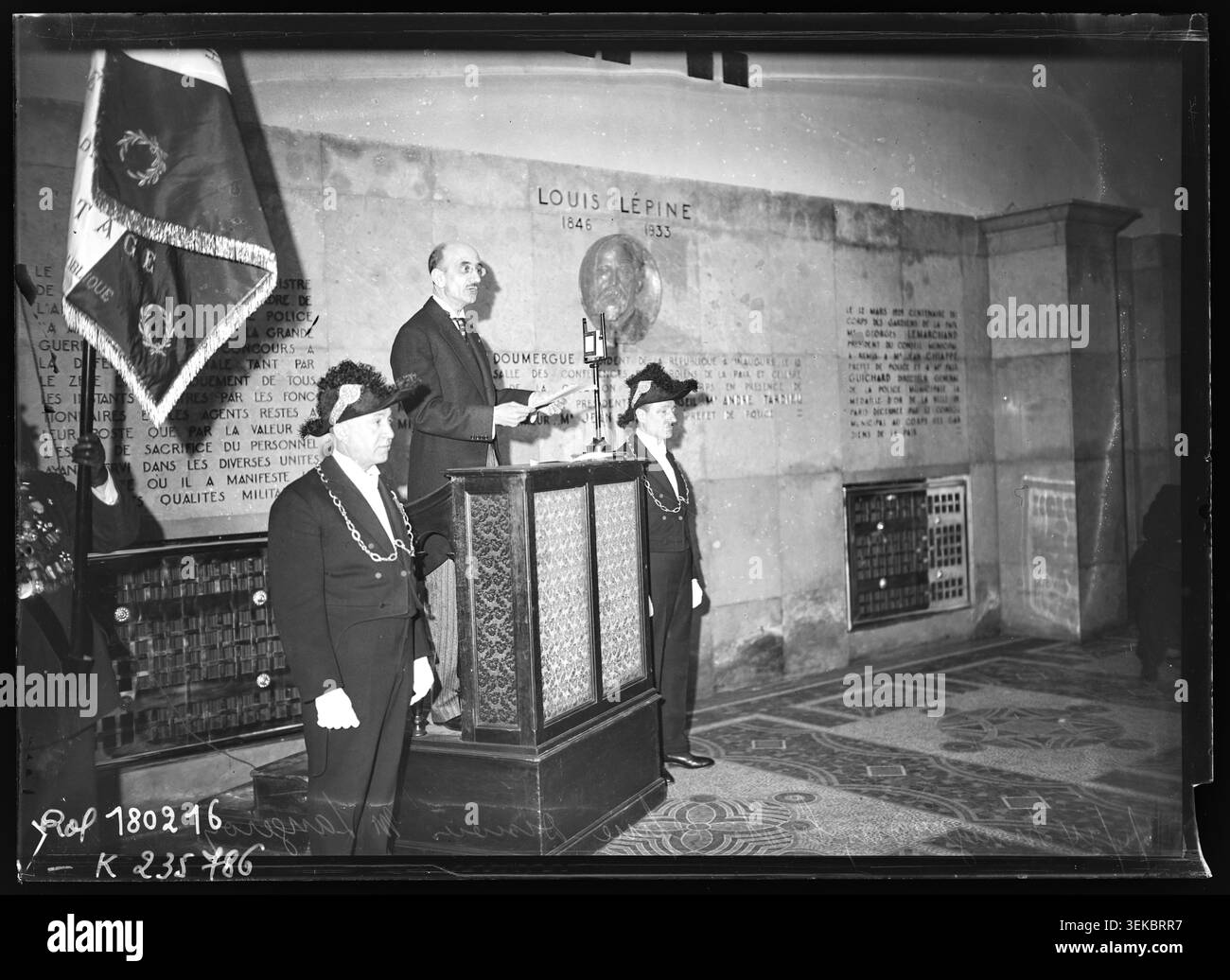 A press photograph records the inauguration of a bust of Louis Lépine at the Paris Police Headquarters on the Île de la Cité on 26 April 1934. Roger Langeron delivered a speech during the official commemorative ceremony. Stock Photo