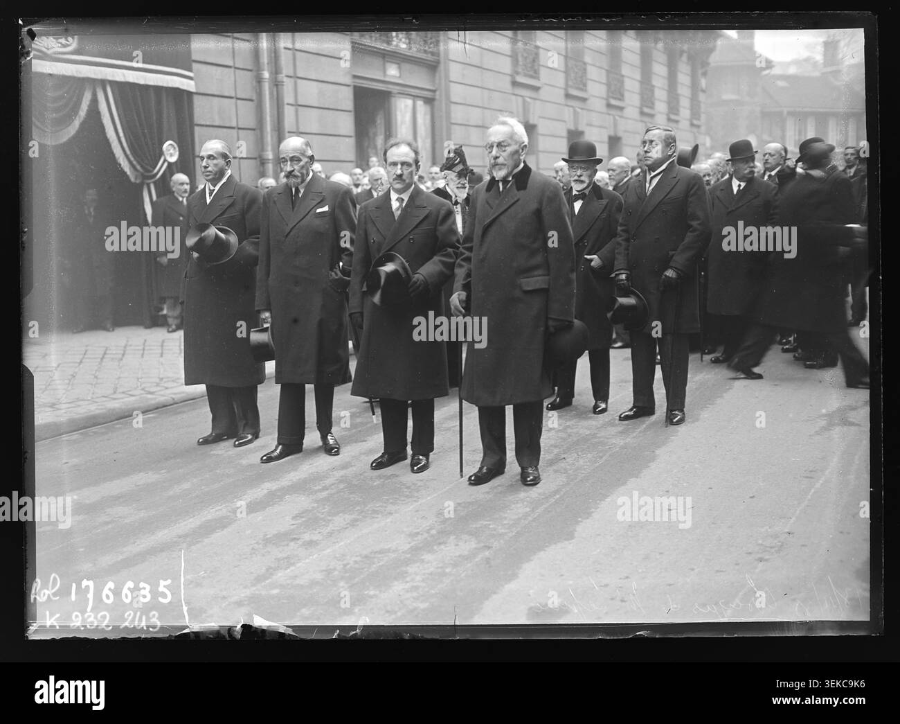 The funeral procession for Louis Lépine gathers at his residence on Rue Joseph-Bara in the 6th arrondissement of Paris on 13 November 1933. The press photograph records mourners assembled during the funeral rites and commemorative ceremonies held after his death. Stock Photo