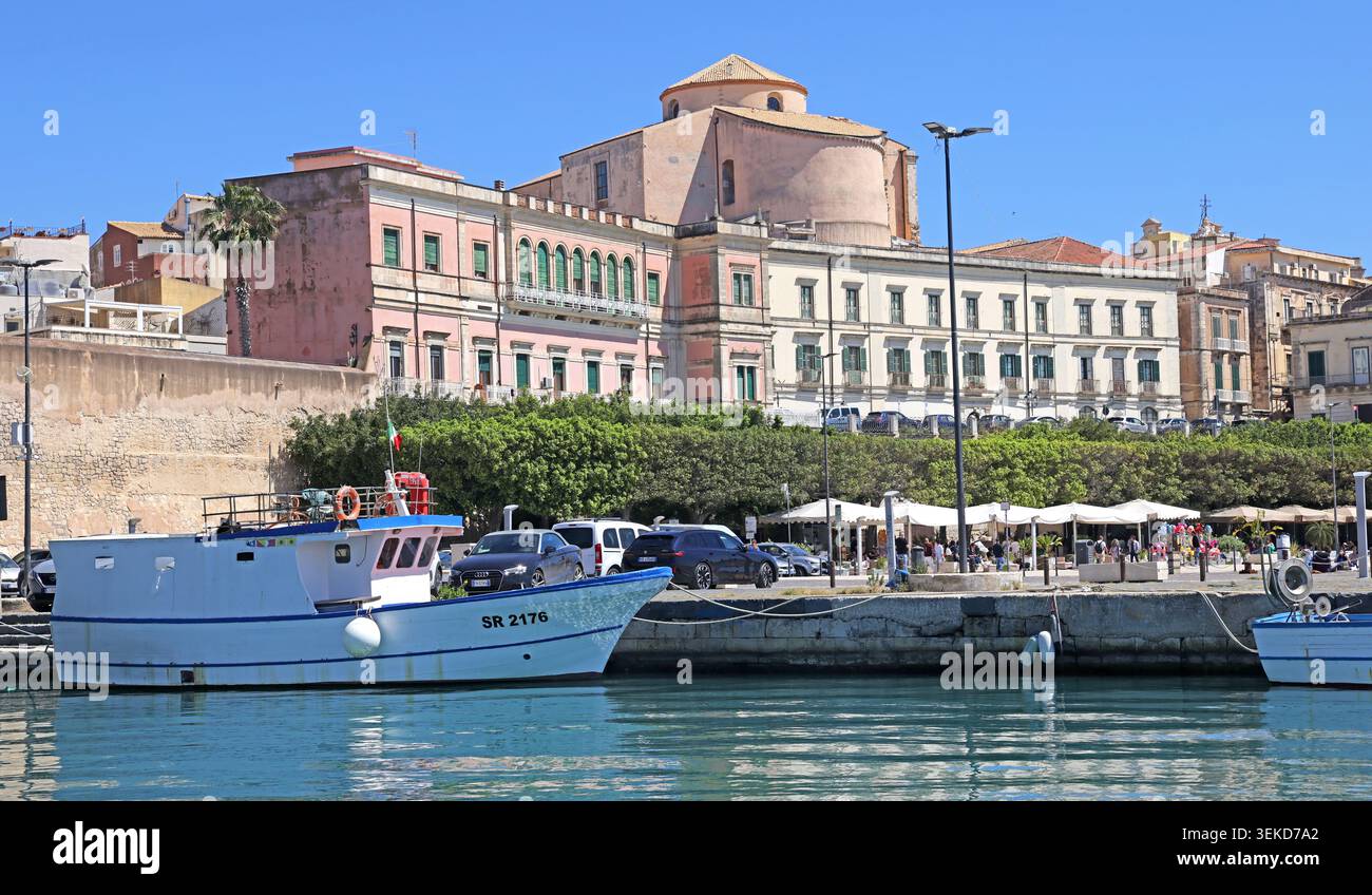 Ortigia waterfront in Siracusa, Sicily, Italy, viewed across the harbour on a bright sunny day. Stock Photo