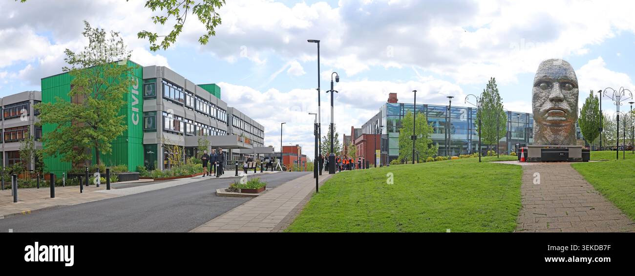 Wigan Civic Centre and Face of Wigan sculpture panorama in Wigan, Greater Manchester, England, UK. Stock Photo