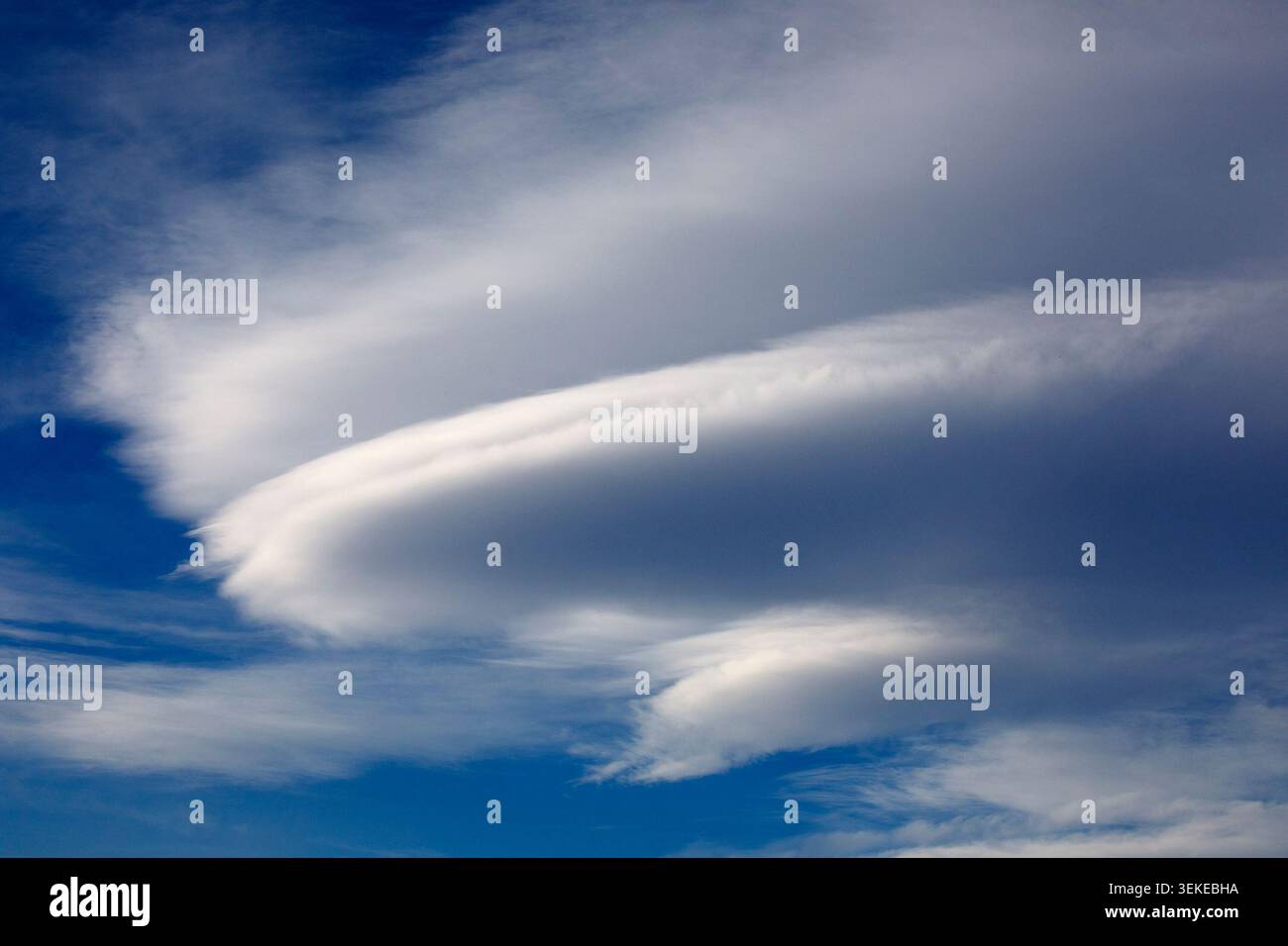 Lenticular cloud formation in blue sky over Calgary, Alberta, Canada Stock Photo