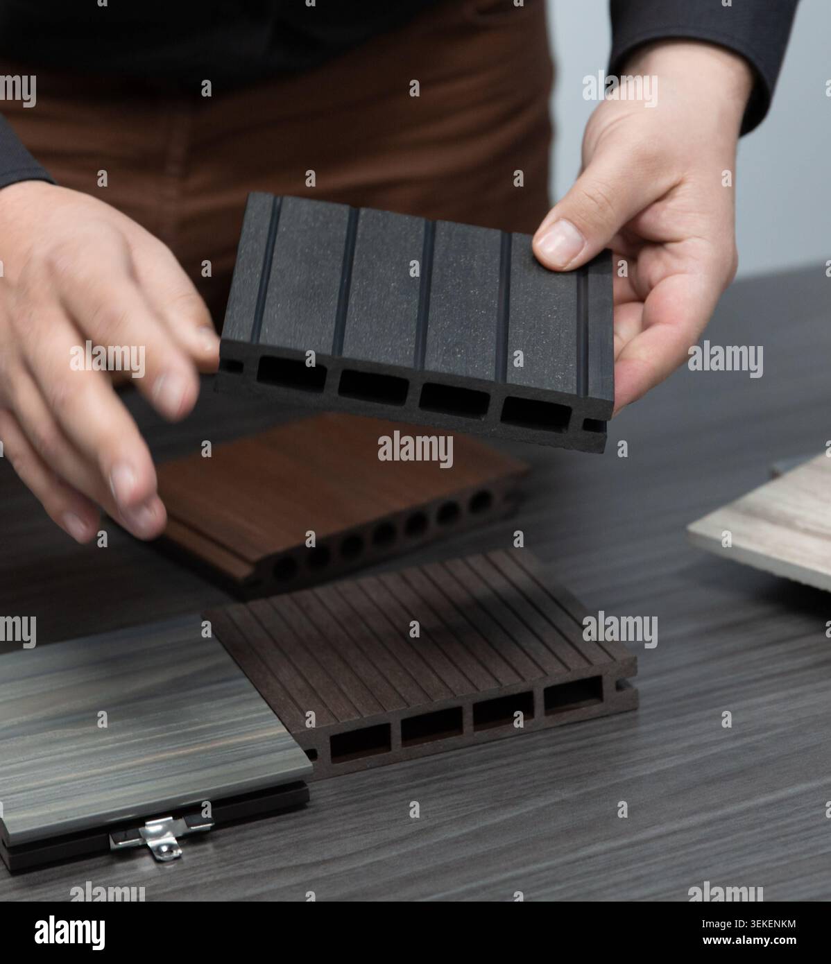shopping for flooring tiles from samples on a table Stock Photo