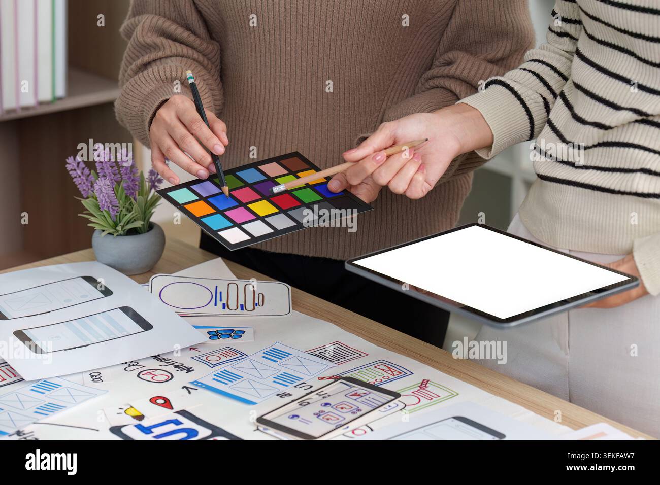 Women designers collaborating on UI UX mobile app development Stock Photo