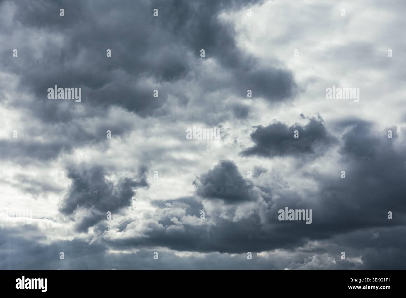 Gray cloudy sky. Dramatic clouds in the dark sky. Stock Photo